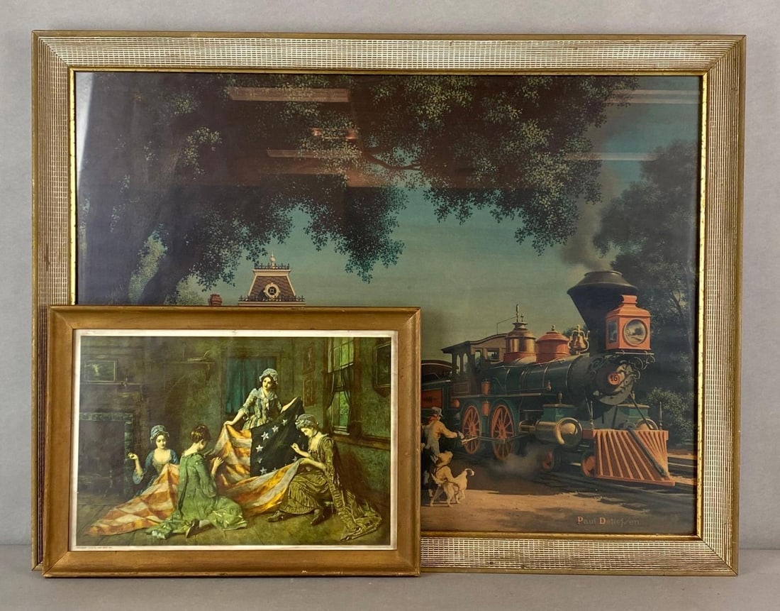 Group of 2 Classic Americana Lithograph Prints: Includes Paul Detlefren Locomotive Station, and Catalda Fine Arts Betsy Ross Flag, Largest frame measures 22 1/2 x 29 3/4 inches.
