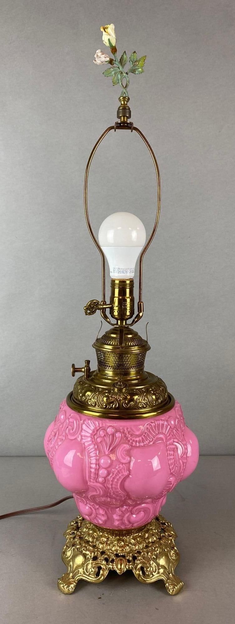 Pink to Clear Cased Glass Electrified Tabletop Oil Lamp: Electrified, In working condition, Pressed glass base with brass feet, Measures 28 1/2 x 8 x 8 inches.