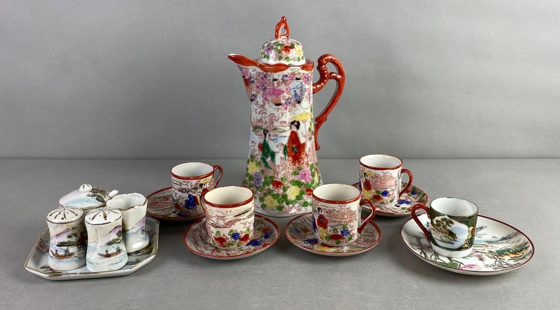 Group of 16 Asian Hand Painted Porcelain Dishes: Includes Nippon and Japan, Includes teapot, creamer and sugar with shakers set, and teacups with saucers. Bottoms marked, largest measures 10 x 6 1/4 x 5 inches