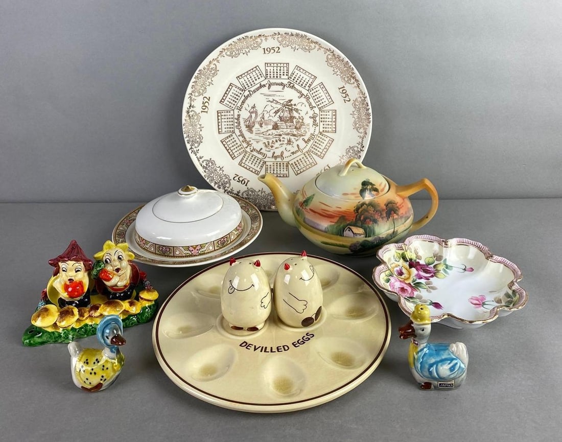 Group of 12 Porcelain Dishes: Includes shakers, plate, teapot and more. Includes Nippon and Japan, condition consistent with age, largest measures 10 inch diameter
