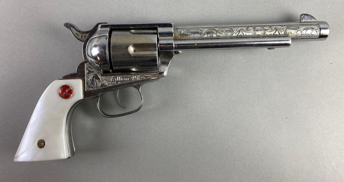 1957-62 Nichols Stallion 45 Mark 2 Cap Gun: In working condition, 6 Metal bullets, nickel die-cast body, cracks on grip, measures 11 3/4 x 5 x 1 3/4 inches