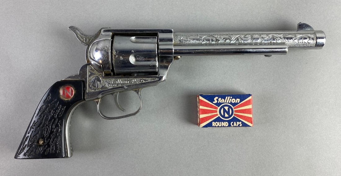 1964-70 Nichols Stallion 45 Mark 2 Cap Gun: Chamber moves but not when trigger is fired, includes 6 plastic bullets, nickel die-cast body, measures 11 3/4 x 5 x 1 1/2 inches
