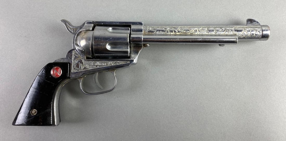 1964-79 Nichols Stallion 45 Mark 2 Cap Gun: Chamber moves but not when trigger is fired, chamber cover is loose, includes 6 plastic bullets, nickel die-cast body, measures 11 1/2 x 5 x 1 1/2 inches