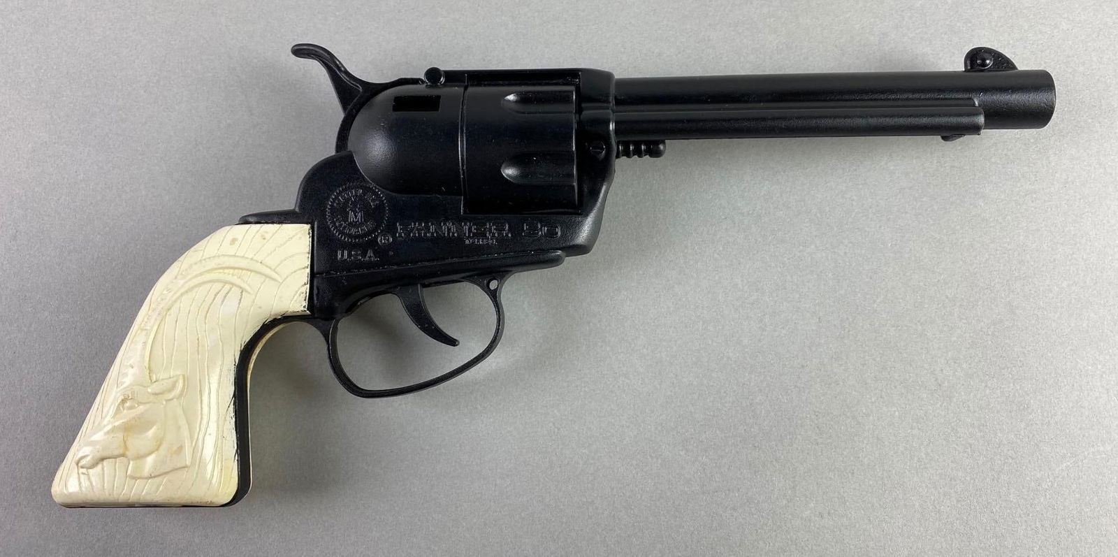 1962 Mattel Fanner 50 Cowboy in Africa Cap Gun: In working condition, fixed chamber, white impala grips, black die-cast body, measures 10 3/4 5 x 1 1/4 inches