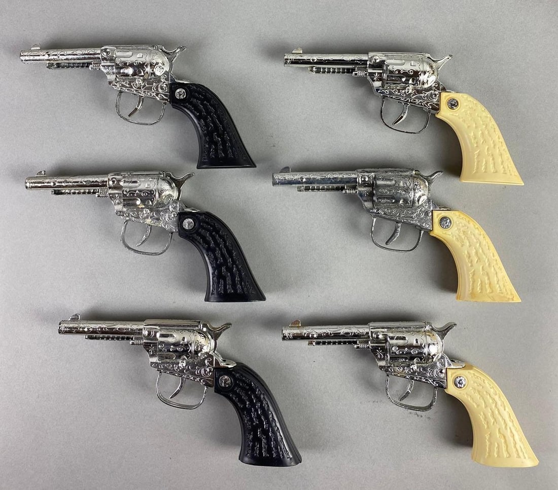 Group of 6 1970 Long Island Die Casting Cap Guns: In working condition, black and white stag grips, measures 7 3/4 x 4 x 1 1/4 inches