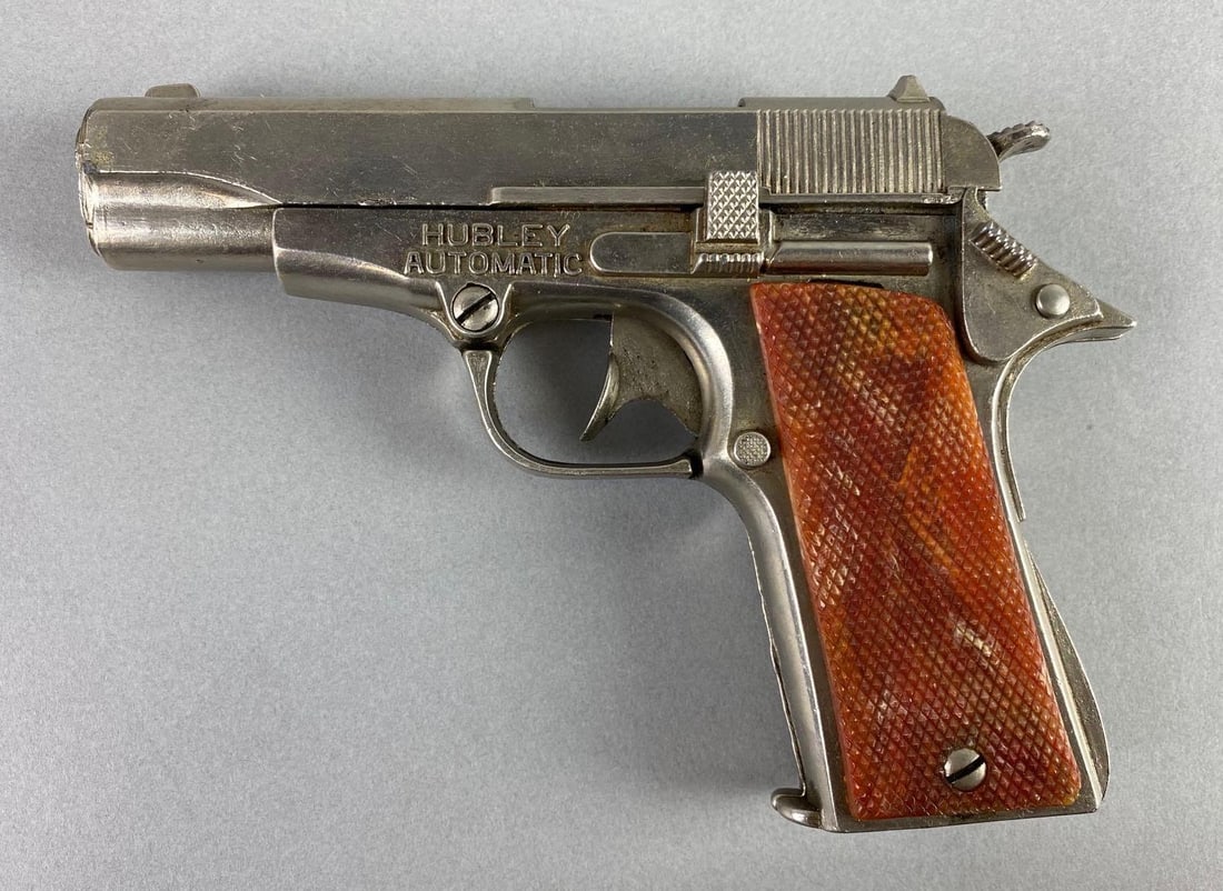 1950s Hubley Automatic 45 Cap Gun: in working condition, die-cast body, measures 6 1/4 x 4 1/4 x 1 1/4 inches