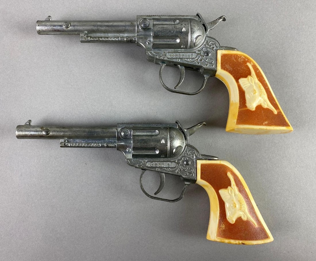 Group of 2 1965-70 Hubley Six Shooter Cap Guns: In working condition, nickel die cast body, measures 8 1/2 x 4 x 1 1/2 inches