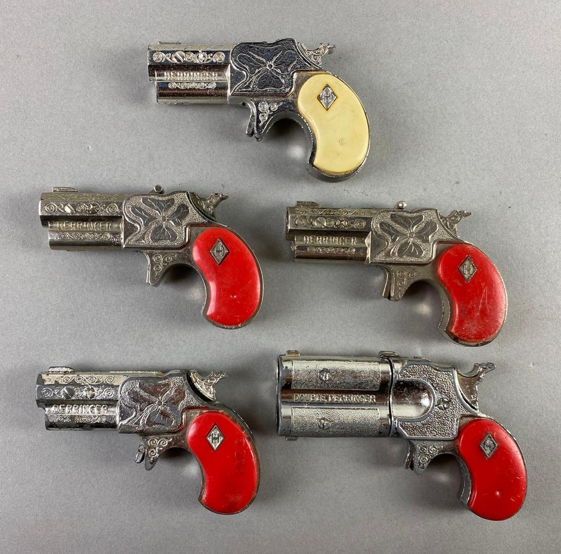 Group of 5 1950s Leslie Henry Derringer Cap Guns: In working condition, includes 2 double barrel, largest measures 3 3/4 x 2 1/4 x 3/4 inches