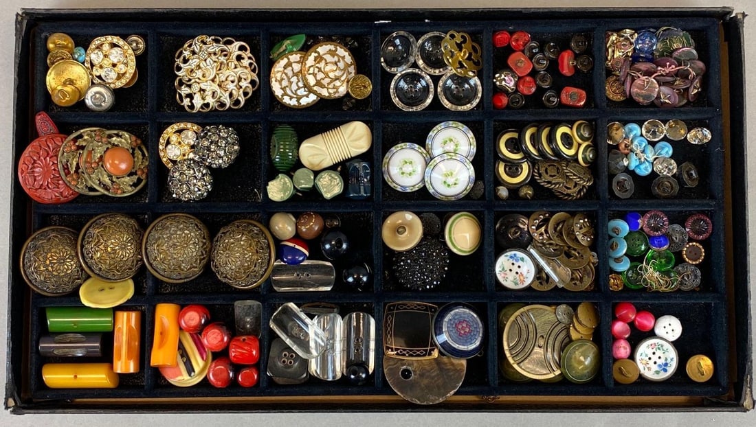 Vintage Group of Costume Buttons: Includes Acrylic, metal, porcelain, rhinestone and plastic. Case has corner wear. Largest button measures 1 3/4 x 1 3/4 inches.