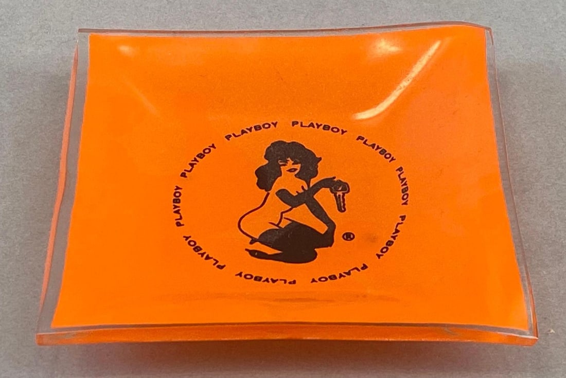 Vintage Orange Playboy Glass Ashtray: Measures 3 3/4 x 3 3/4 x 1 inches