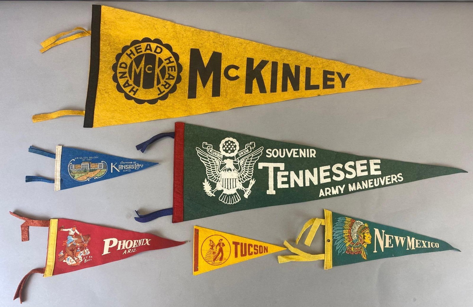 Vintage Group of 6 Pennants US City and State: Mixed condition, largest pennant measures 11 x 29 inches.