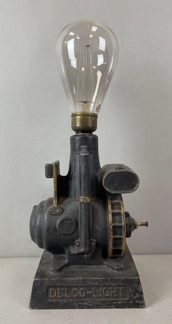 Antique Delco-Light Cast Metal Advertising Lamp with Edison Bulb: Working condition, measures 15 1/2 x 7 x 5 1/4 inches with bulb
