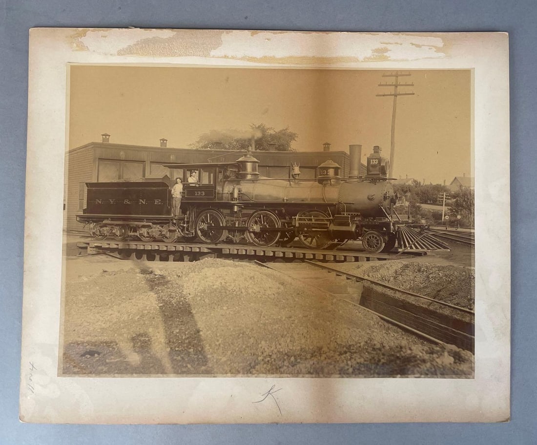 Antique N.Y. and N.E. Steam Locomotive Mounted Albumen Photograph: Engine #133. Measures 13 x 16 inches overall