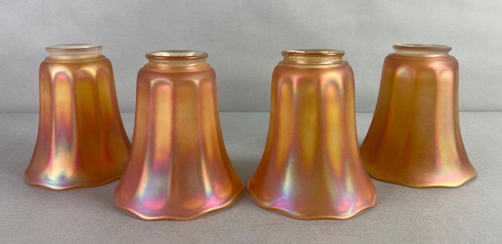 Set of 4 Vintage Nuart Iridescent Glass Shades: Some cracks and chips around fitter edges, measures 5 1/4 x 5 inches, fitting measures 1 1/2 inches