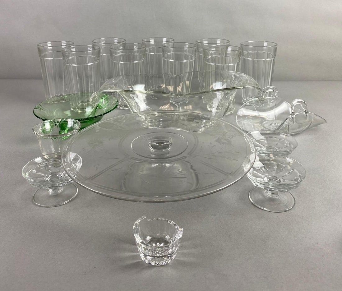 Group of 18 Vintage Heisey Glass Items: Includes 1 green glass footed dish, cake pedestal, cups, and more. Condition consistent with age, largest measures 3 3/4 x 12 1/4 x 5 1/4 inches