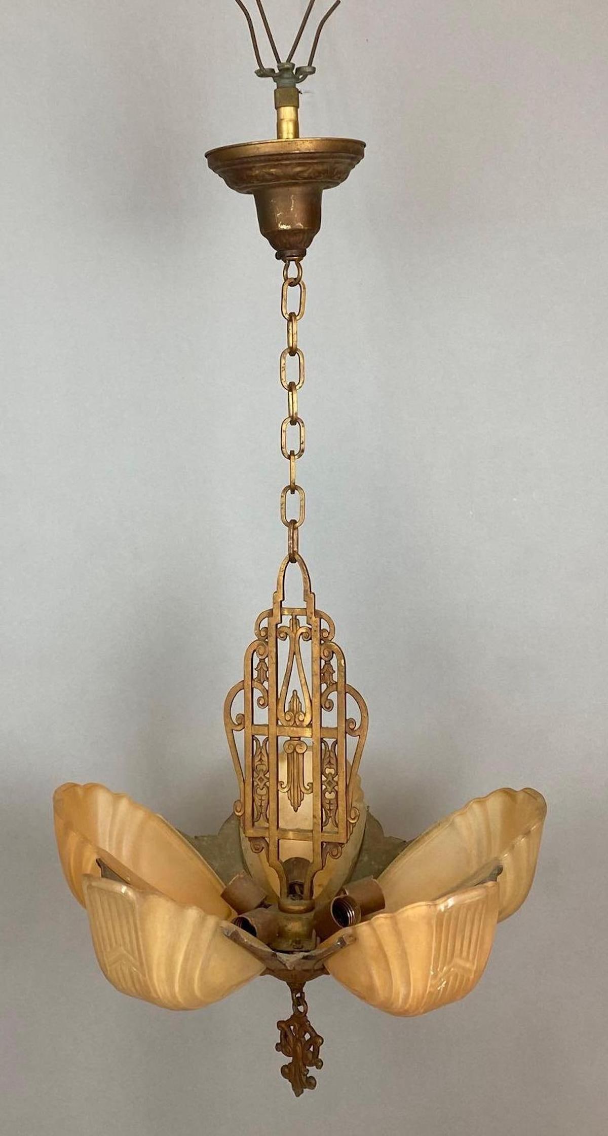 Art Deco Metal Hanging Chandelier with Amber Glass Slip Shades: Electrified, Untested, With 5 Art Deco Iridescent slip shades, Measures 36 x 16 x 16 inches.