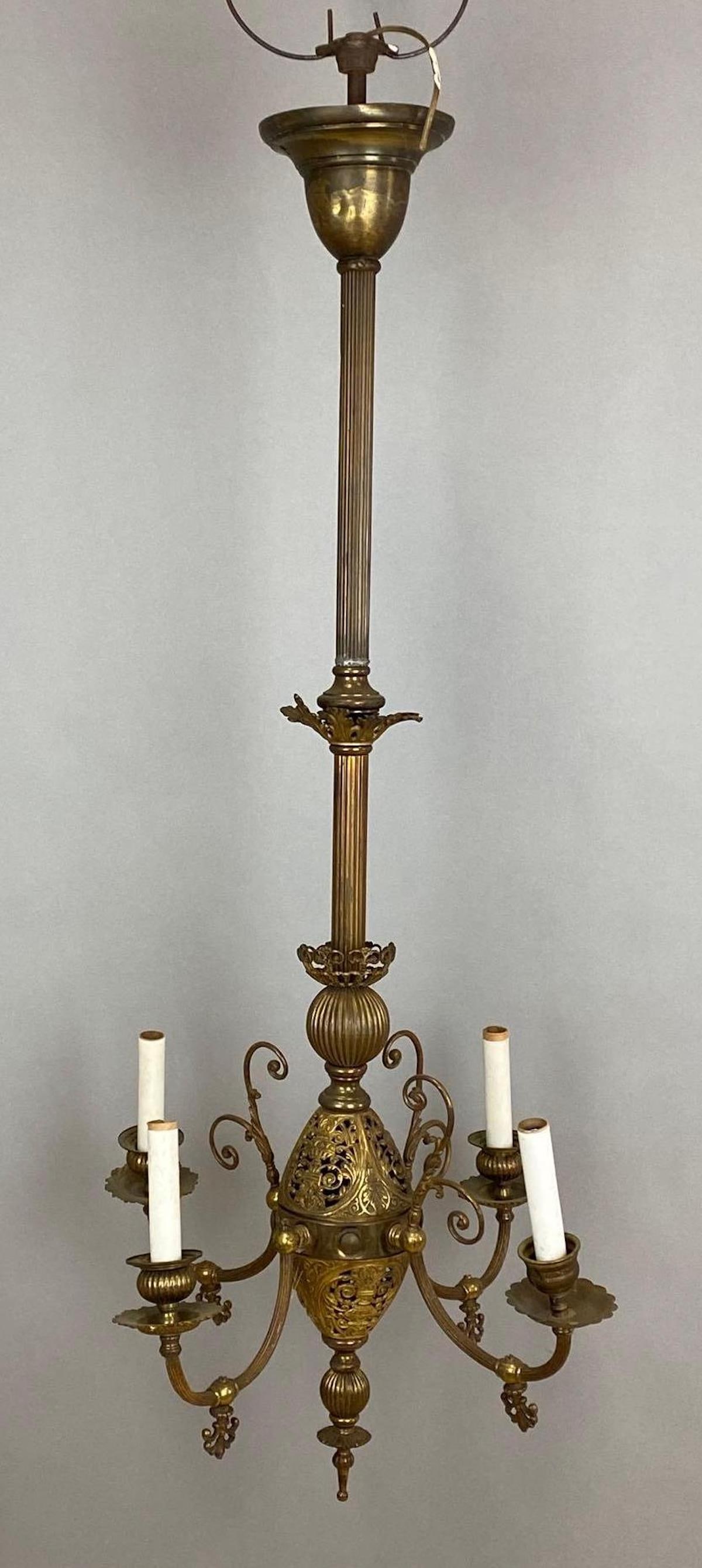 Antique Brass 4-Arm Electric Chandelier: Untested, With 4 candlestick tubes, Wired, Measures 43 x 14 x 14 inches.