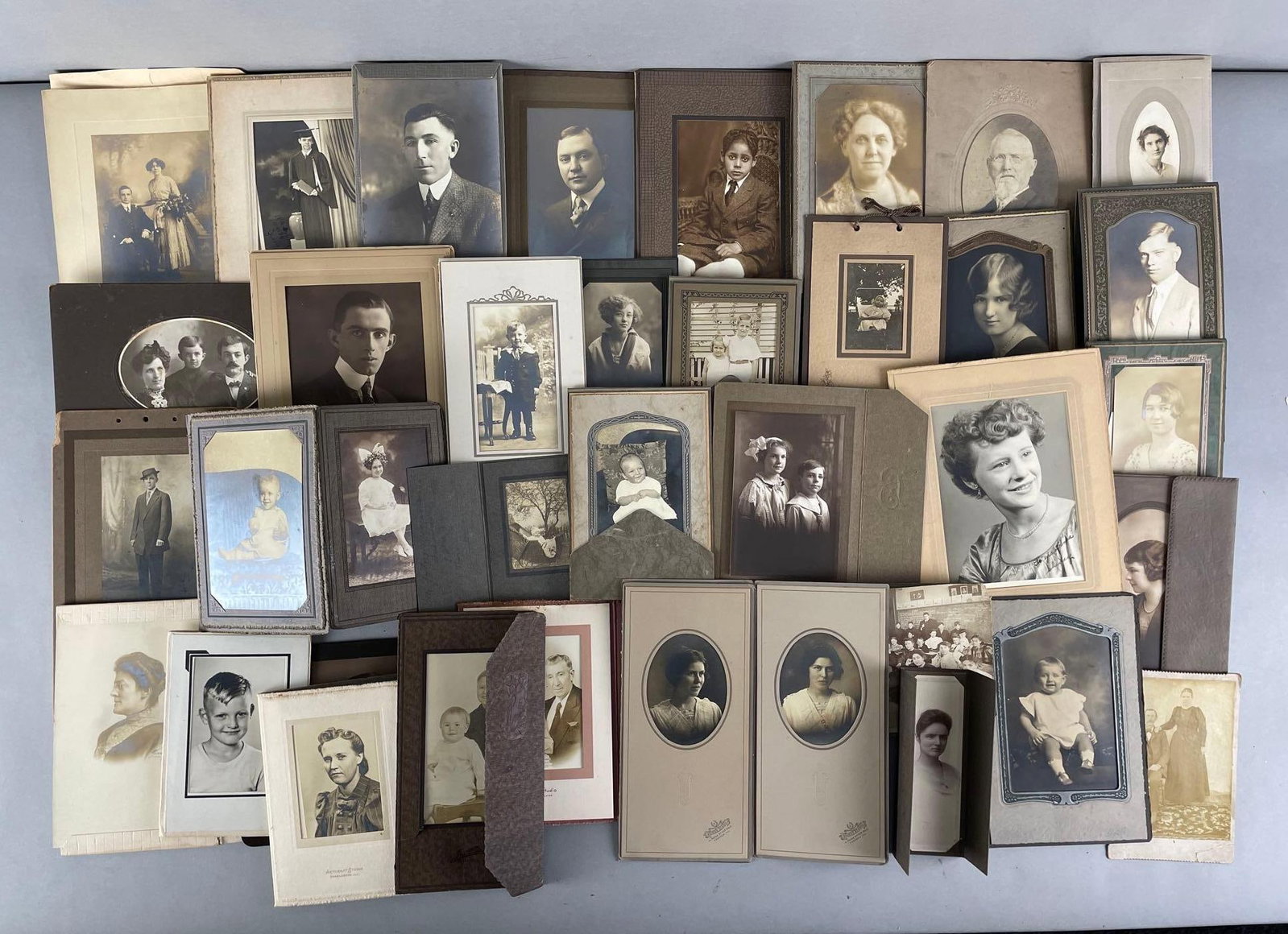 Group of 35+ Antique Portrait Photographs: Each with paper frame. Largest photo measures 5 x 7 inches