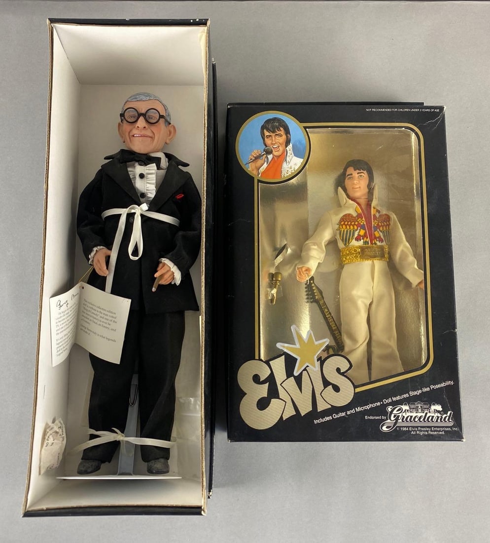 1984 Elvis and 1996 George Burns Dolls in Original Boxes: Both new in original boxes. Elvis box has edge and surface wear, made by Eugene Doll Company Graceland Enterprises. George Burns V529 by Effanbee Doll Company. Elvis Doll measures 12 inches tall, Geor