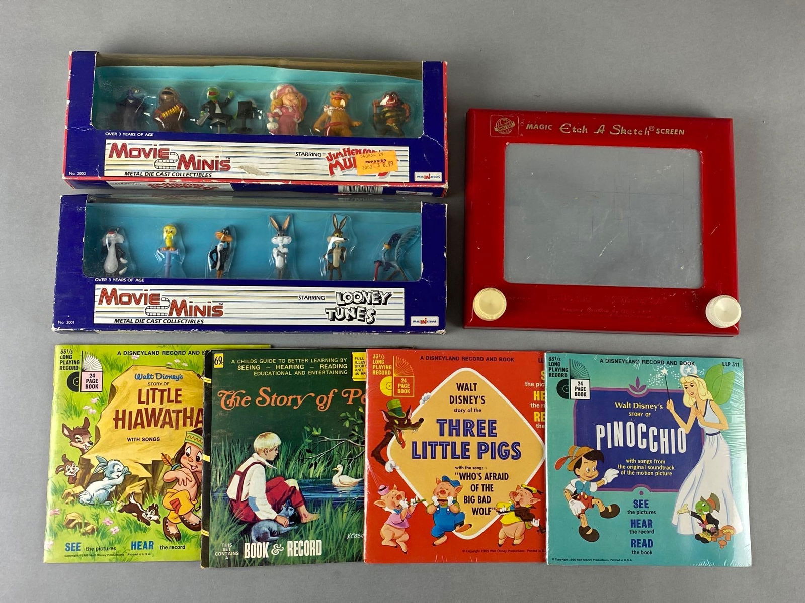 Vintage Group of Die Cast Toys Disney Books Records Etch A Sketch: 7 total items including 4 Disney Sory Books with Records, 2 boxes of Die Cast Collectibles and used working Etch A Sketch with surface wear.