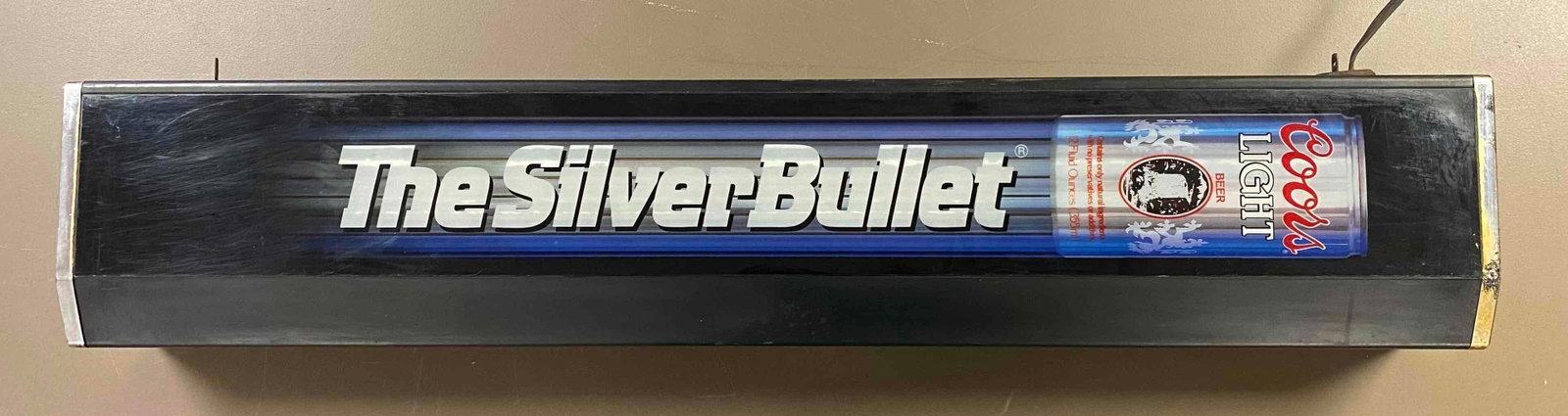 Coors Light Silver Bullet Advertising Motion Beer Sign: Rotating Lights work. Item has external wear with rust. Measures 9 x 40 x 5 inches.