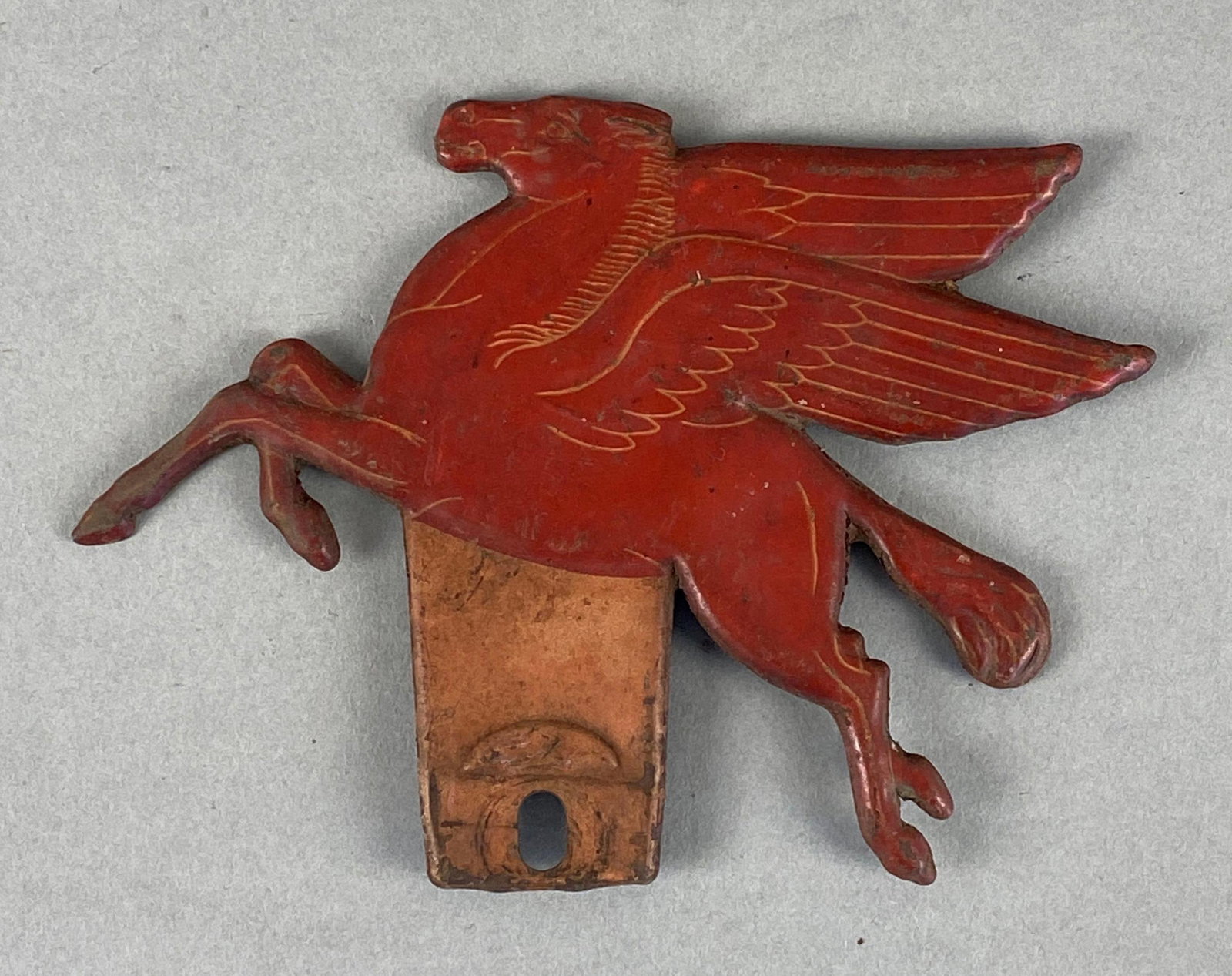 Vintage Mobile Pegasus Gas and Oil Advertising License Plate Topper: Accessory from the 1940s. Some wear and rust. Measures 5 x 6 1/2 inches.