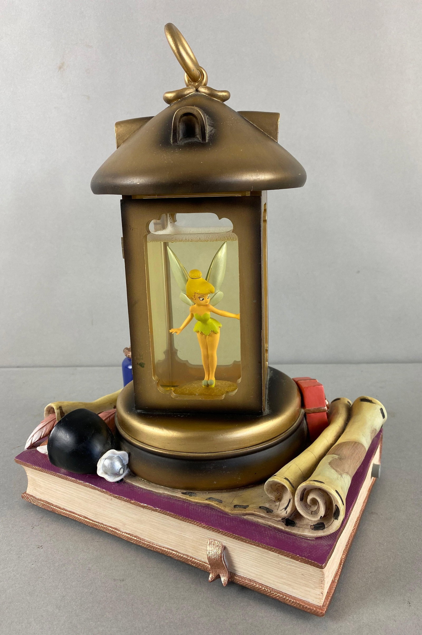 Disney Tinkerbell Lantern Musical Snowglobe: Pixie Dust Blower button on side not working. Item measures 12 x 8 1/2 x 6 inches.