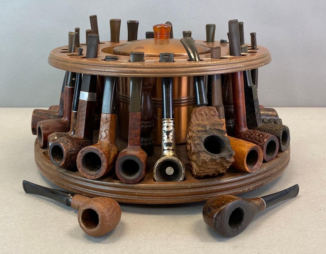24 Slot Tobacco Pipe Rack with Humidor: Includes rack, metal humidor, and 26 tobacco pipes, includes names such as Stonehenge, King-Sway, Craftsman, Willard, Kaywoodie, Malaga, Albertson, Weler, and more, Rack measures 6 x 13 x 13in.