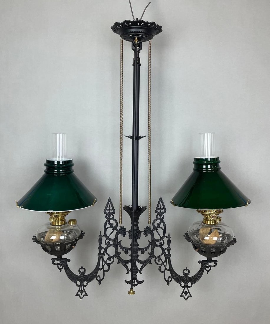 Victorian Cast Iron 2 Arm Chandelier with Student Glass Shades: Adjustable. Fitters measure 3 inches. Chandelier measures 35 x 29 inches