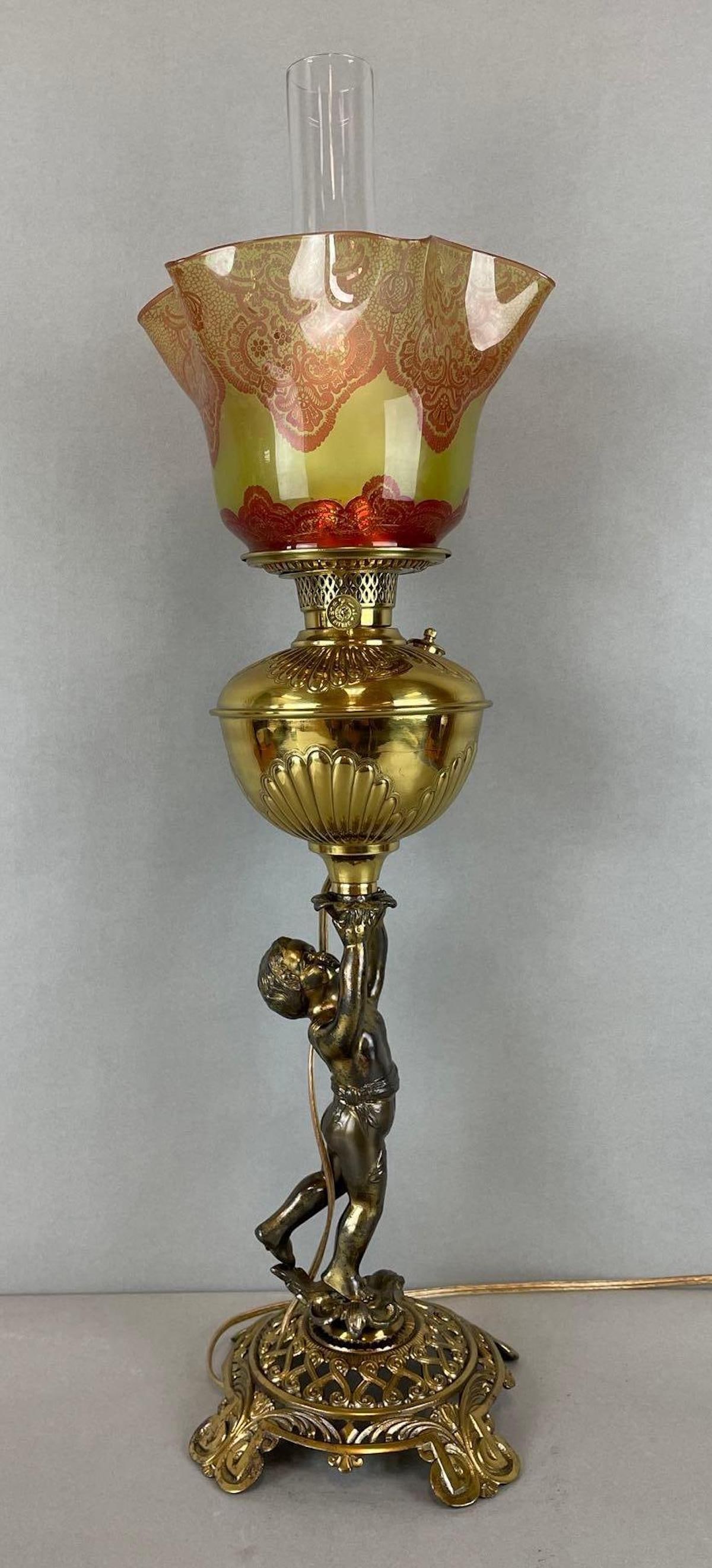 Victorian Figural Cherub Table Lamp with Yellow to Amber Laced Shade: Working condition brass lamp. Fitter measures 4 inches, lamp measures 28 inches