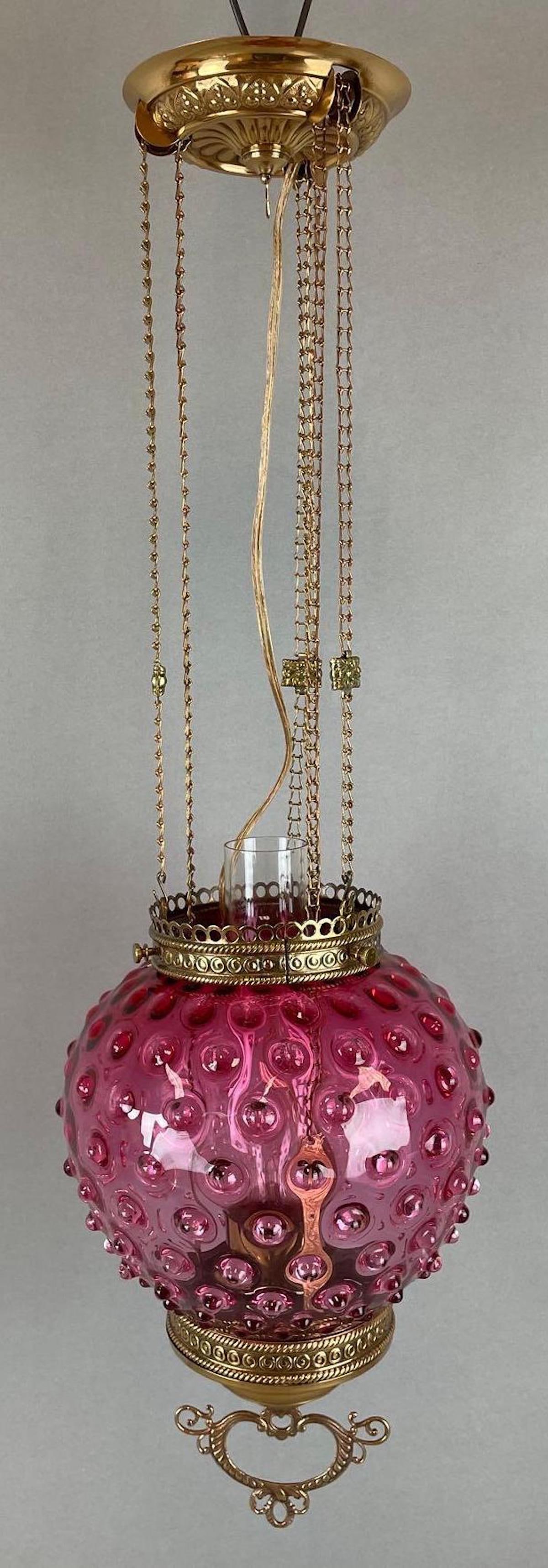 Victorian Brass Hanging Pendant Lamp with Hobnail Cranberry Glass Shade: Electric, untested. Fitter measures 4 1/4 inches, 27 1/2 inches overall, lamp measures 14 inches