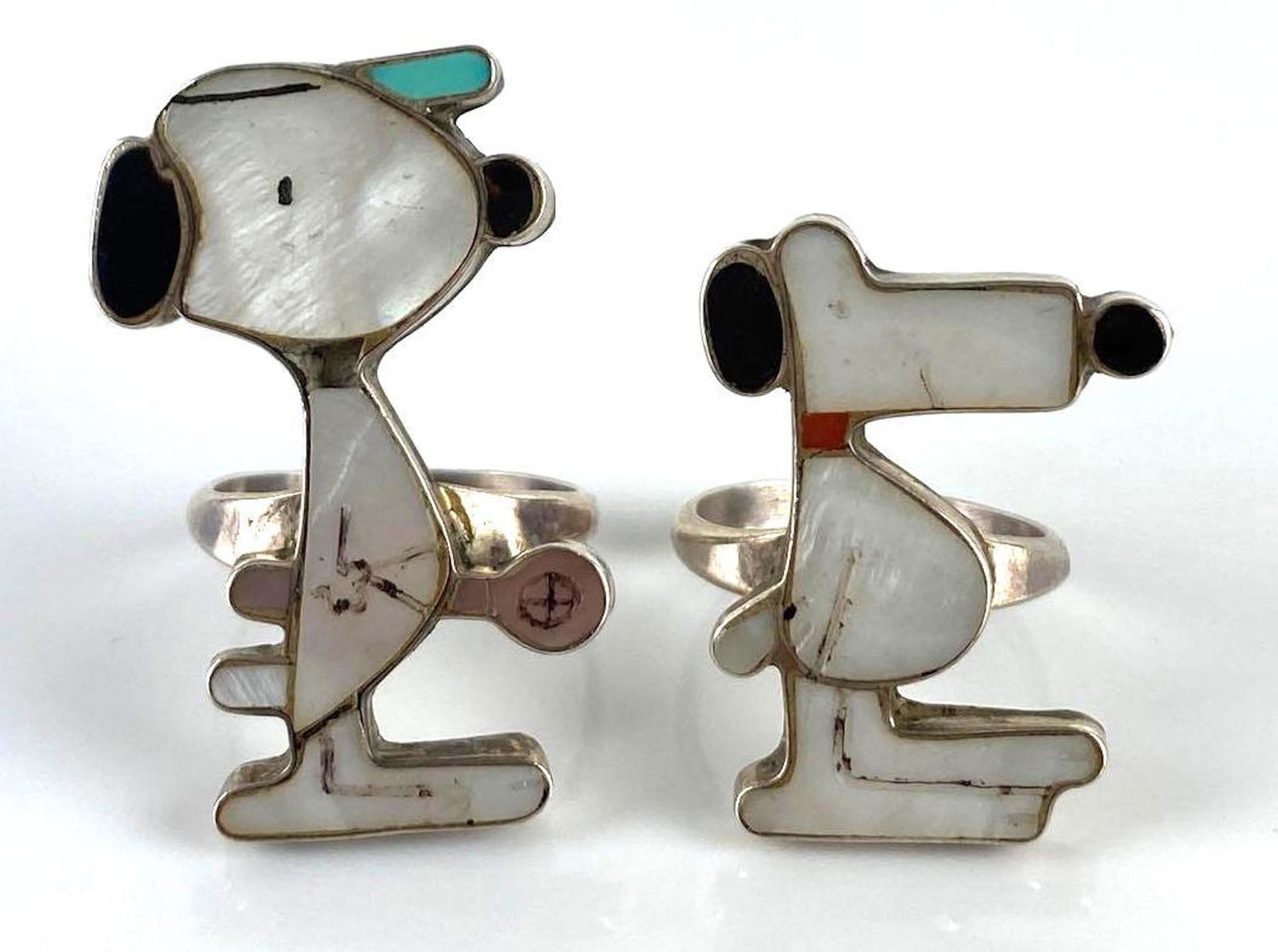Group of 2 Signed F.T. Abalone Shell Snoopy Rings: 9.1g total weight, largest size 7