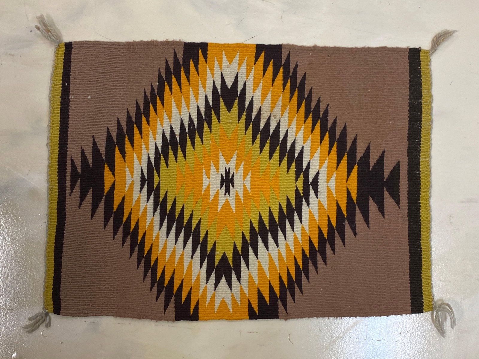 Vintage Navajo Small Blanket Storm Pattern: Good condition, measures 17 x 24 inches.