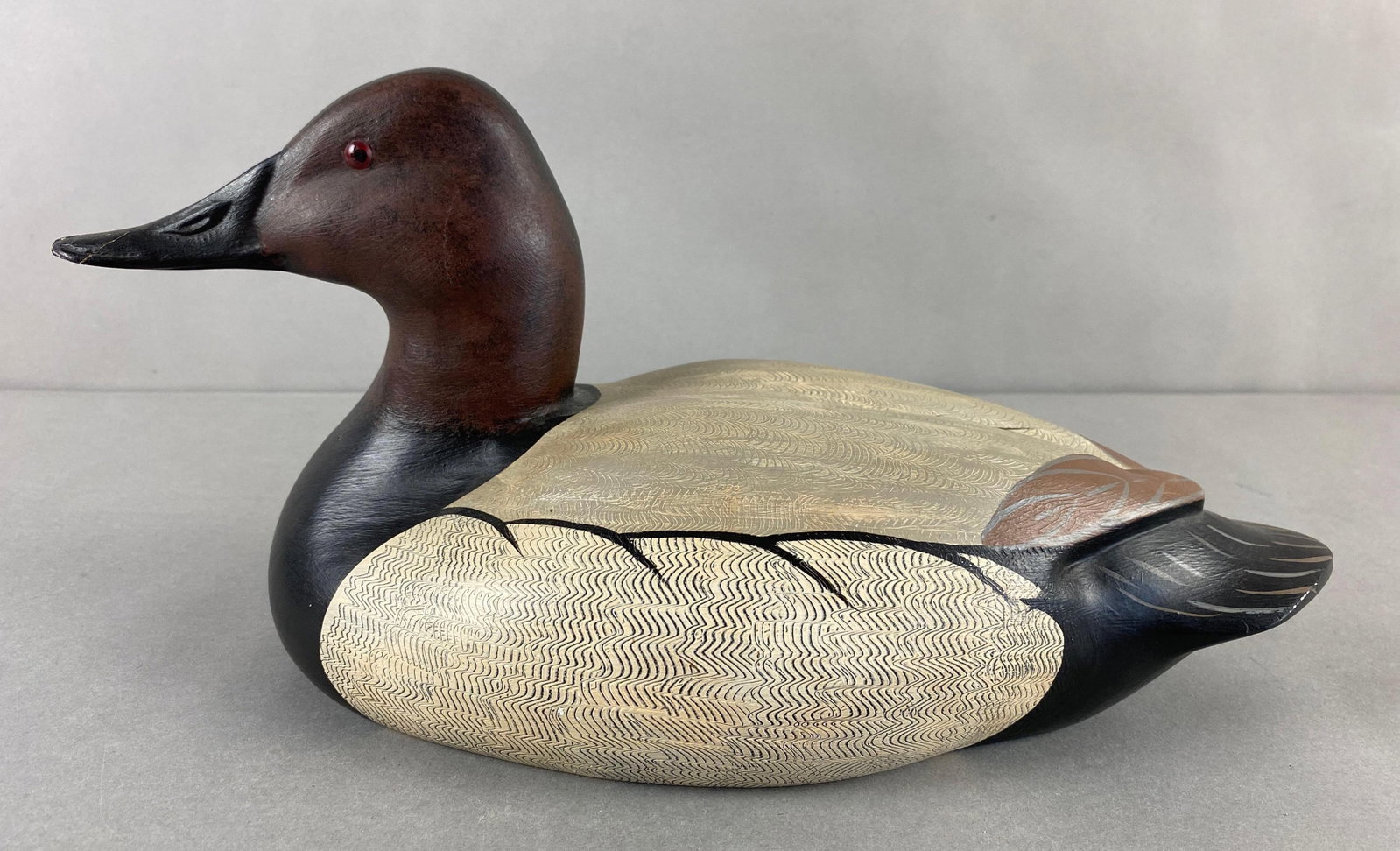 2004 Nancy Peterson Wood Duck Decoy: Beak repaired. Measures 8 1/2 x 15 x 7 inches