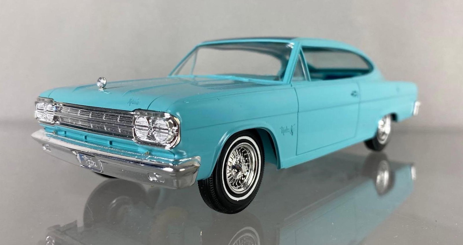 1966 Rambler Marlin Dealership Promo Car: Met Aqua/Blue. Friction wheels working condition. Measures 8 x 3 x 2 1/2 inches.