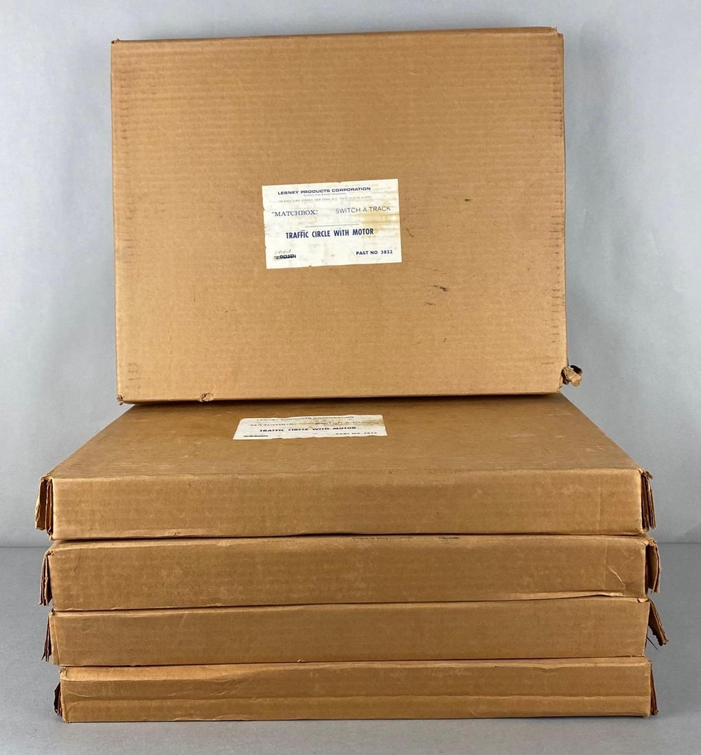 Group of 5 Matchbox No. 3822 Switch-A-Track Traffic Circle with Motor: A Lesney Product, All with original boxes, Unknown set completions, Most labeled with one piece, Boxes measure 15 x 18 1/2 x 2 inches.