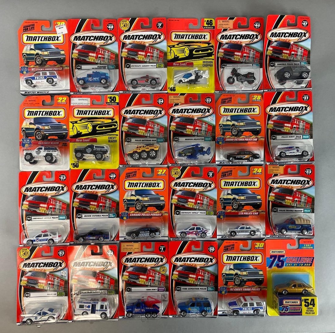 Group of 20+ Matchbox Die-Cast Police Vehicles: Includes Camaro, hummer, Chevy blazer, and more, original packaging