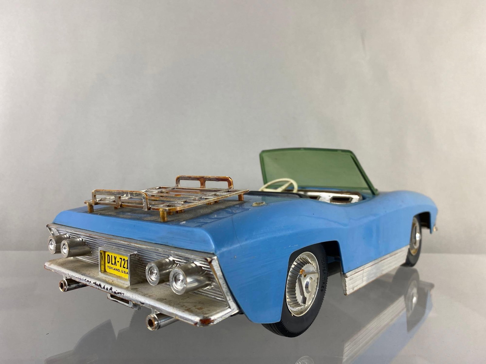 Topper Dawn Blue Action Convertible Car: No Doll, action components missing. Wear on exterior and some rust. Measures 4 1/2 x 15 x 6 inches.