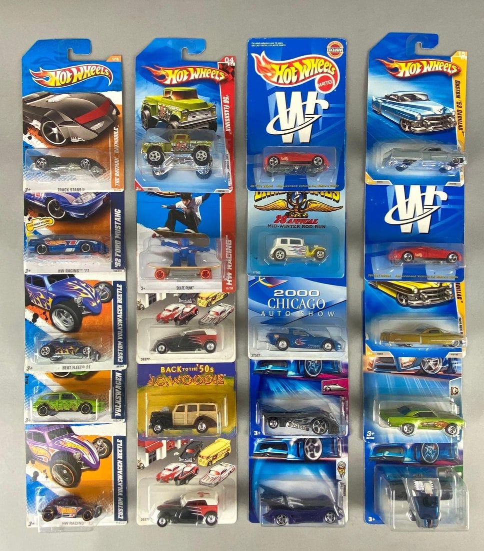 Group of 20 Hot Wheels Die-Cast Vehicles: In original packaging, Mattel, Includes No. 92 Fatbax Jacknabbit Special, No. 1 Batmobile, No. 15 Custom 1953 Cadillac, and more, Largest packaging measures 6 1/2 x 4 1/2 x 1 3/4 inches.