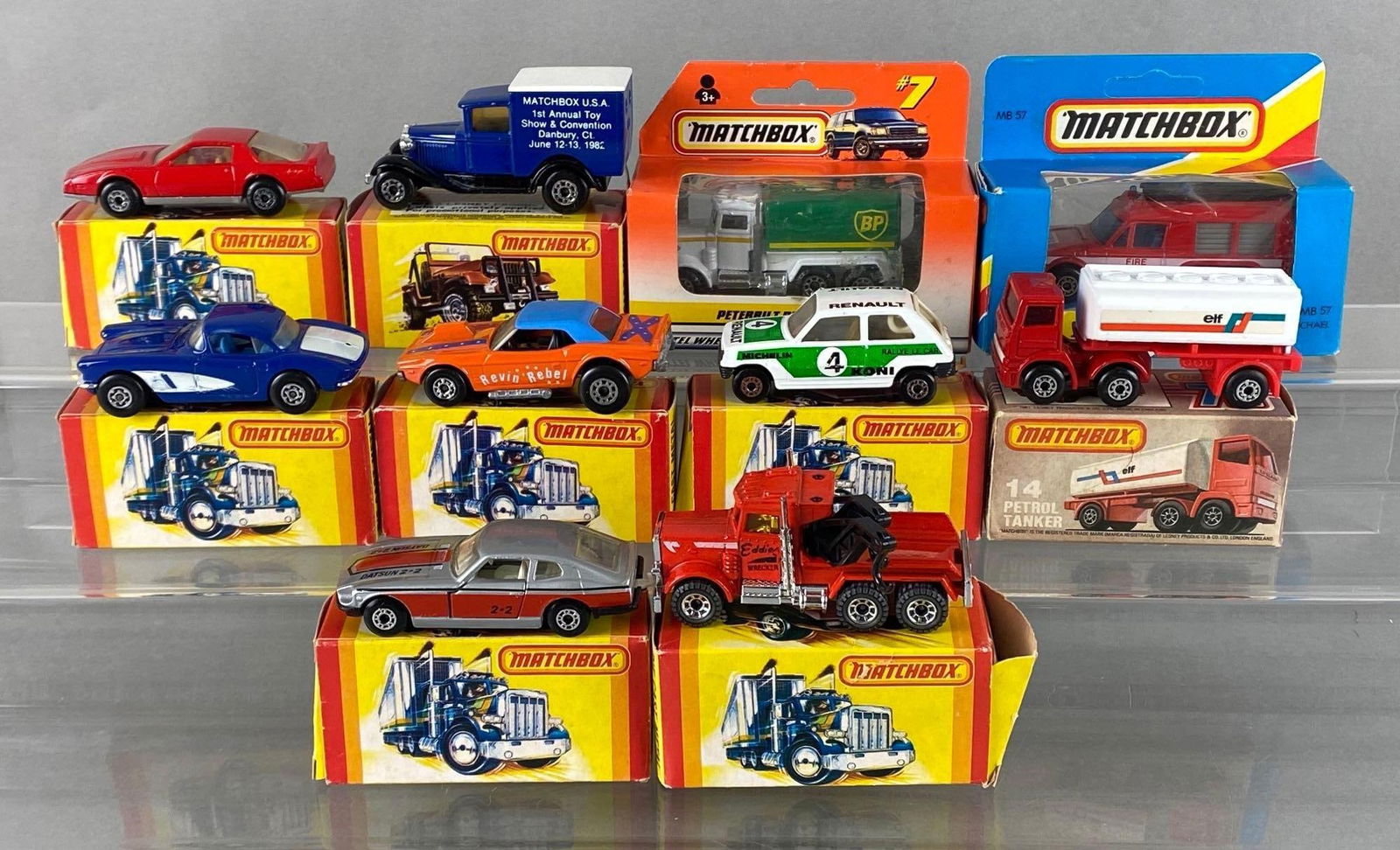 Group of 10 Matchbox Die-Cast Vehicles: With boxes, A Lesney Product, Includes No. 14 Petrol Tanker, No. 71 Corvette, No. 1 Revin Rebel, and more, Some tears or missing pieces of boxes, Largest box measures 3 x 4 x 1 1/2 inches.