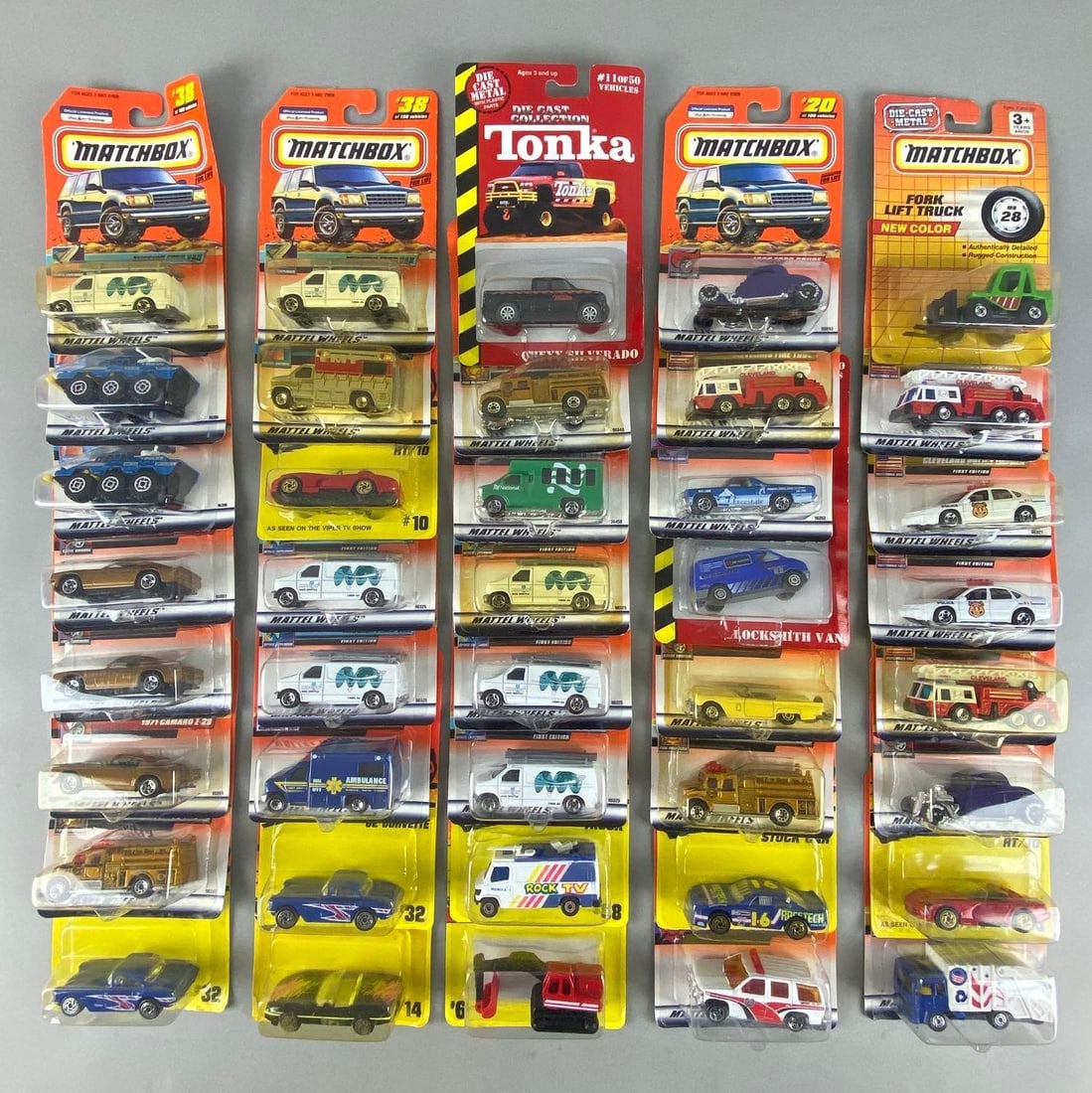 Group of 40 Matchbox and Tonka Die-Cast Vehicles: All in original packaging, Includes No. 68, No. 32, No. 10, and more, Largest packaging measures 7 x 4 1// x 1 1/4 inches.