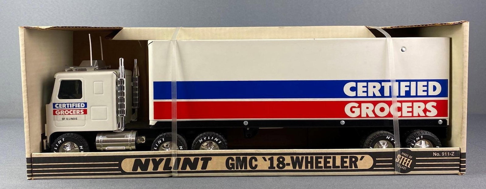 Nylint Certified Grocers Pressed Steel GMC 18 Wheeler: Packaging measures 7 1/2 x 22 x 6 inches. New in original packaging