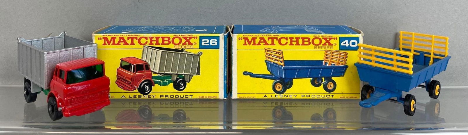 Group of 2 Matchbox Die-Cast Vehicles: Includes no 40 hay trailer, no 26 gmc topper truck. Lesney product, made in England. Includes original boxes. 1/64 scale