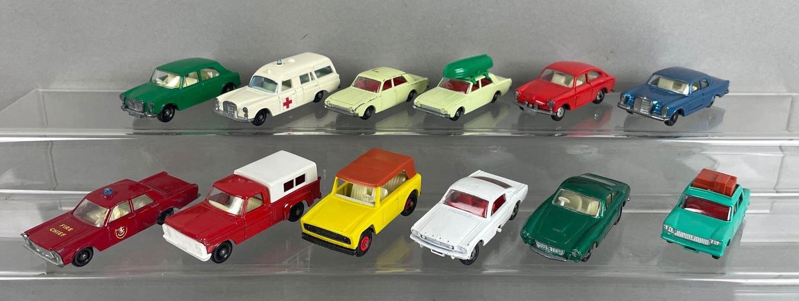Group of 12 Vintage Matchbox Die-Cast Vehicles: Includes 55/59 ford galaxie, no 6 ford pickup, no 75 Ferrari berlinetta, and more. Lesney products, made in England