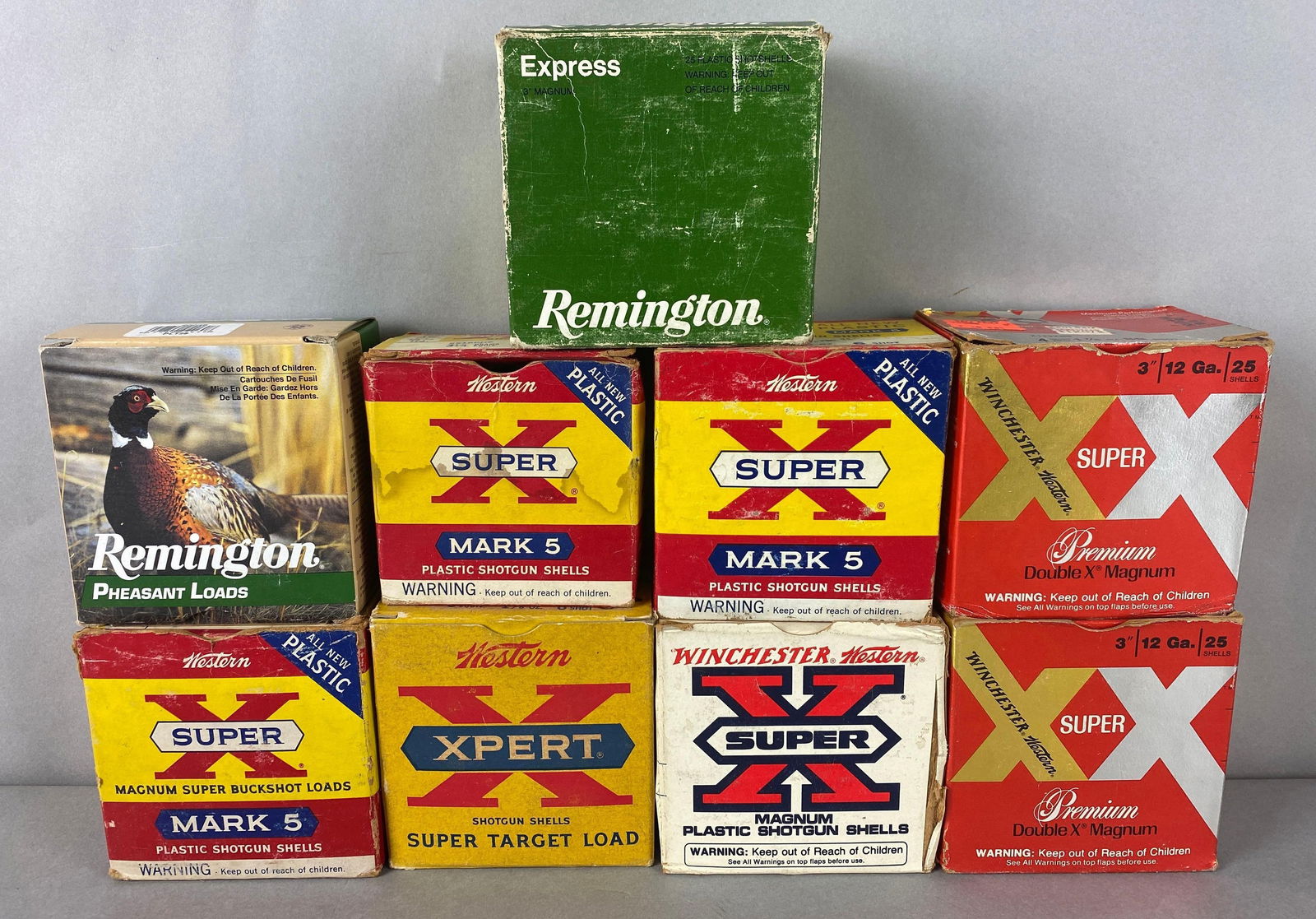 Group of Vintage 12 Gauge Shotgun Ammunition: Includes Full box Xpert 2 3/4 in 1 1/8oz 8 shot, Full box Xpert 4 Dr. Eq. 1 7/8oz 2 shot, 22 Shell Xpert 3in 41 pellets 4 buckshot, Full box Xpert 2 3/4in 1 1/4oz 6 shot, 7 shells Xpert 3 1/4 Dr.Eq. 1
