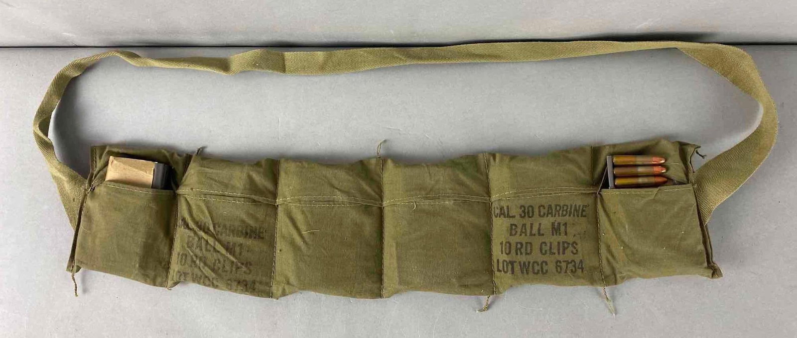 US Army Cal. 30 Carbine Ball M1 Ammunition Bandolier w/ 12 10 Round Clips: Cal. 30 Carbine Ball M1 Lot WCC 6734, 12 total 10 round clips.
