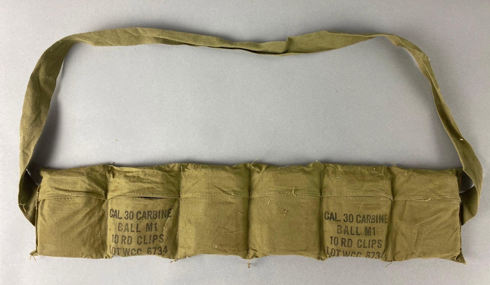 US Army Cal. 30 Carbine Ball M1 Ammunition Bandolier w/ 12 10 Round Clips: Cal. 30 Carbine Ball M1 Lot WCC 6734, 12 total 10 round clips.