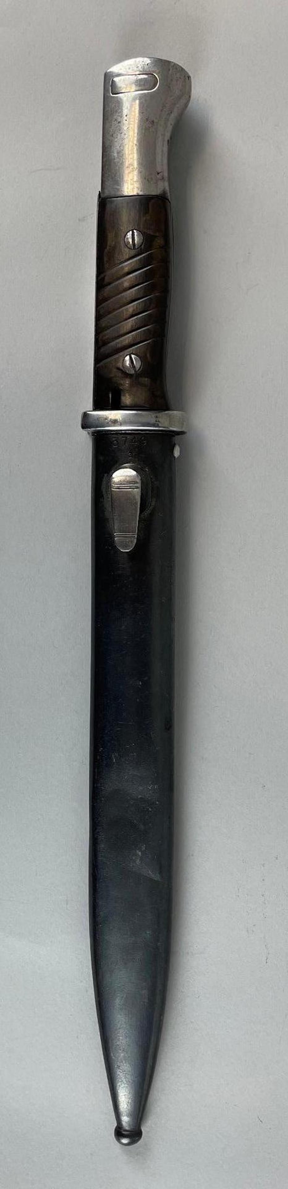 1943 WW2 German Panzer Grenadier Division Etched Bayonet with Scabbard: Mundlos. Scabbard is dented. Measures 15 1/4 inches overall with a 10 inch blade