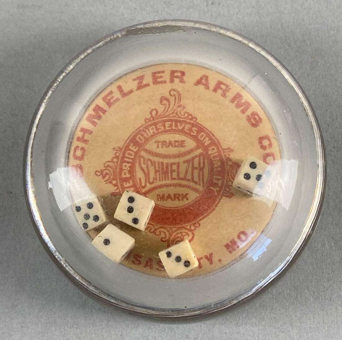 Schmelzer Arms Co. Dice Advertising Paperweight: Glass paperweight with dice inside, Kansas City Missouri, Measures 1 3/4 x 3 x 3 inches.