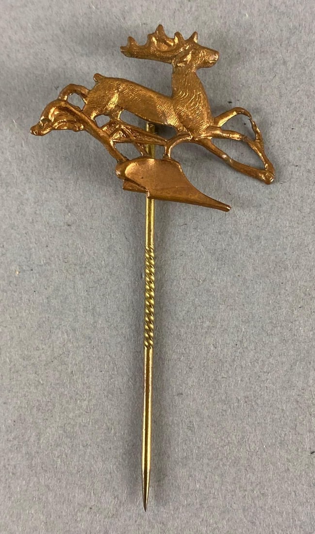 Deering and McCormick Stick Pin: John Deere, Measures 2 1/4 x 1 inches.
